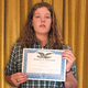 Jamie Ganser reluctantly poses with her award.